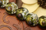 10505202 - Seven Emerald Treasure Lentil Beads