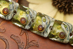10505204 - Seven Emerald Treasure Pillow Beads