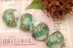 10505812 - Four Mint Stardust Lentil Beads