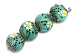 10508512 - Four Seafoam Florals Lentil Beads