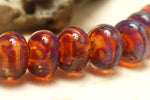10602601 - Seven Orange & Purple Free Style Rondelle Beads