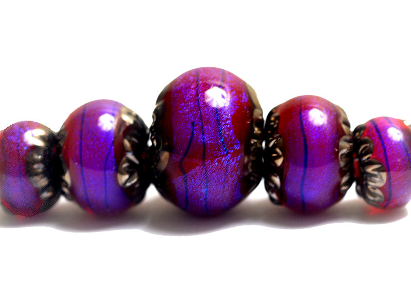 10604011 - Five Violet Shimmer Graduated Rondelle Beads
