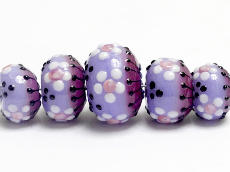 10605111 - Five Purple Blossom Graduated Rondelle Beads