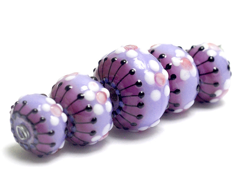 10605111 - Five Purple Blossom Graduated Rondelle Beads