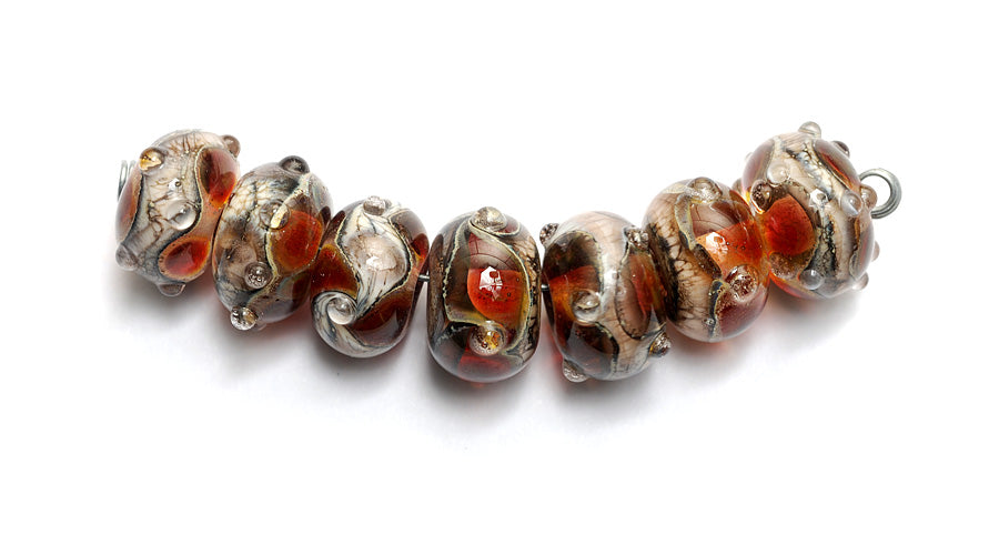 10703801 - Seven Transparent Red w/Silver Foil Rondelle Beads