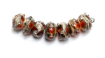 10703801 - Seven Transparent Red w/Silver Foil Rondelle Beads