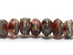 10703801 - Seven Transparent Red w/Silver Foil Rondelle Beads
