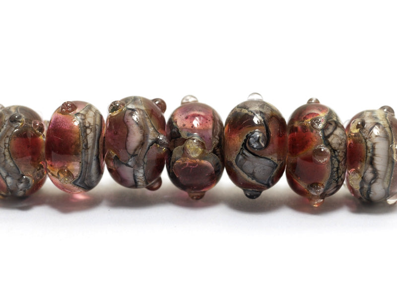 10703801 - Seven Transparent Red w/Silver Foil Rondelle Beads