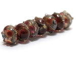 10703801 - Seven Transparent Red w/Silver Foil Rondelle Beads