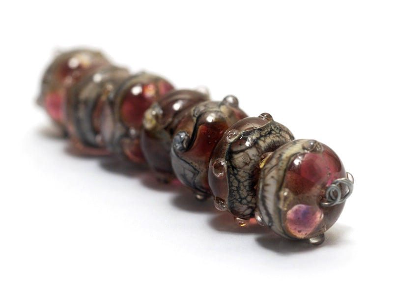 10703801 - Seven Transparent Red w/Silver Foil Rondelle Beads