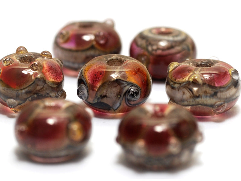 10703801 - Seven Transparent Red w/Silver Foil Rondelle Beads
