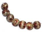 10703802 - Seven Transparent Red w/Silver Foil Lentil Beads