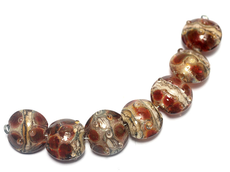 10703802 - Seven Transparent Red w/Silver Foil Lentil Beads