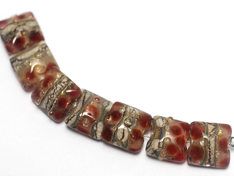 10703804 - Seven Transparent Red w/Silver Foil Pillow Beads