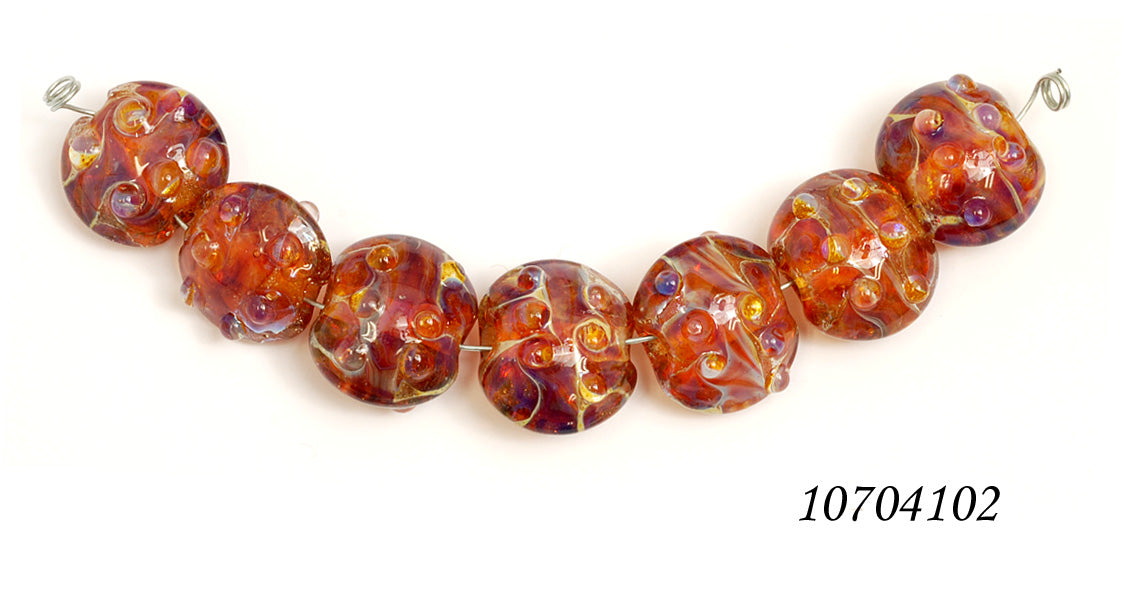 10704102 - Seven Orange Lentil Beads