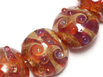 10704102 - Seven Orange Lentil Beads