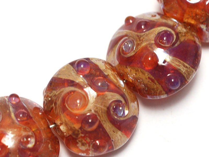 10704102 - Seven Orange Lentil Beads