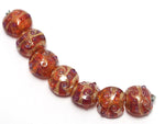 10704102 - Seven Orange Lentil Beads