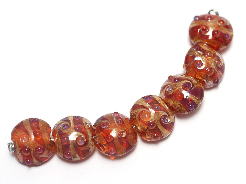 10704102 - Seven Orange Lentil Beads