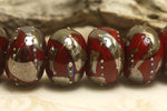 10704201 - Seven Regal Red Metallic Rondelle Beads