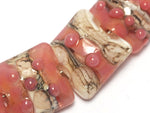 10704304 - Seven Pink/Soft Orange Pillow Beads