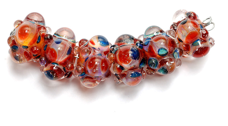 10704821 - Six Red w/Blue Rondelle Beads