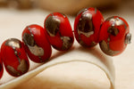 10705001 - Seven Electric Orange Metallic Rondelle Beads