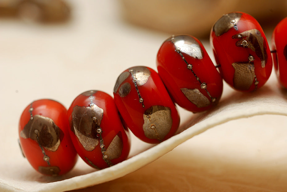 10705001 - Seven Electric Orange Metallic Rondelle Beads