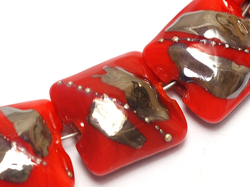 10705004 - Seven Electric Orange Metallic Pillow Beads