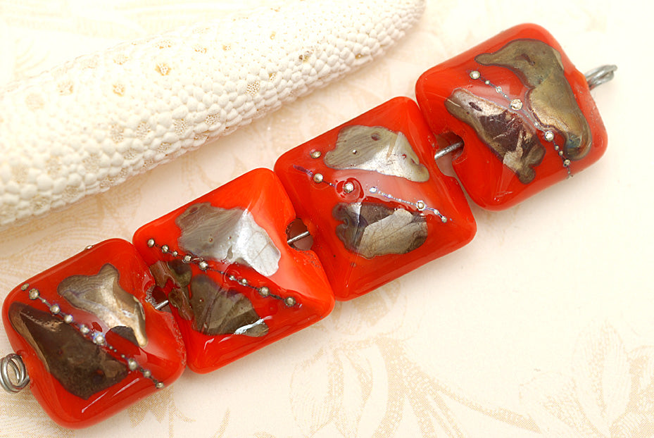 10705014 - Four Electric Orange Metallic Pillow Beads