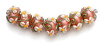 10706201 - Seven Ivory Mist Flower on Coral Rondelle Beads