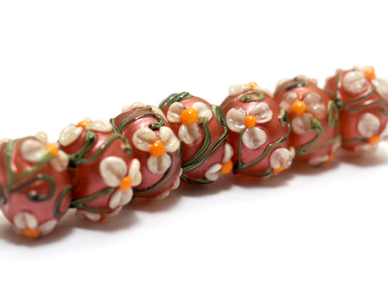 10706201 - Seven Ivory Mist Flower on Coral Rondelle Beads