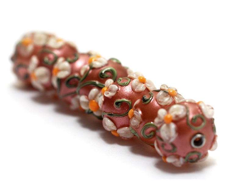 10706201 - Seven Ivory Mist Flower on Coral Rondelle Beads