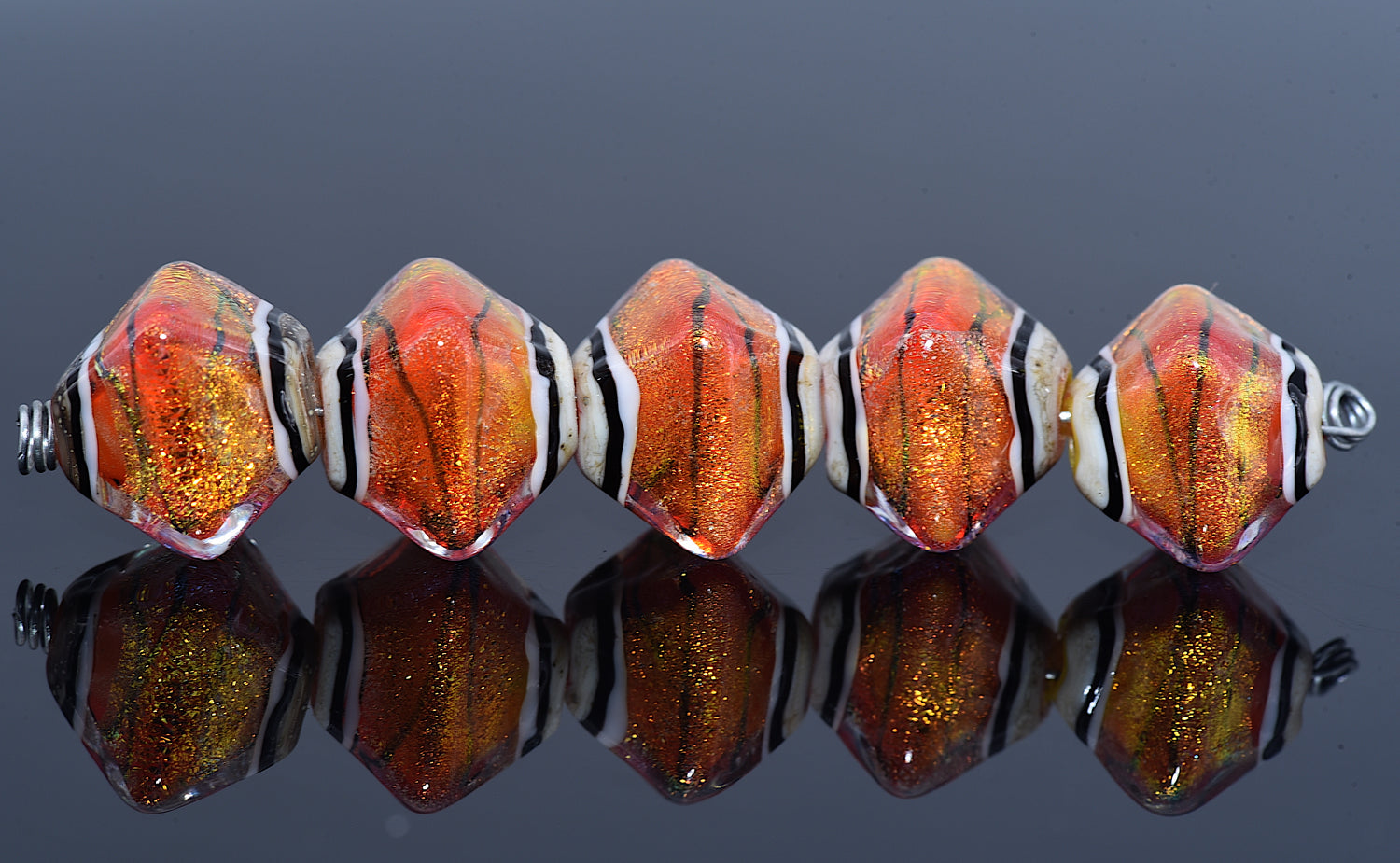 10706807 – Five Orange Dichroic Crystal Beads