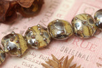 10800802 - Seven Black w/Yellow Silver Foil Lentil Beads