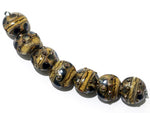 10800802 - Seven Black w/Yellow Silver Foil Lentil Beads