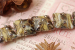 10800804 - Seven Black w/Yellow Silver Foil Pillow Beads