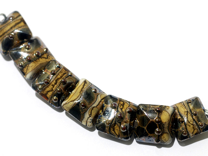 10800804 - Seven Black w/Yellow Silver Foil Pillow Beads