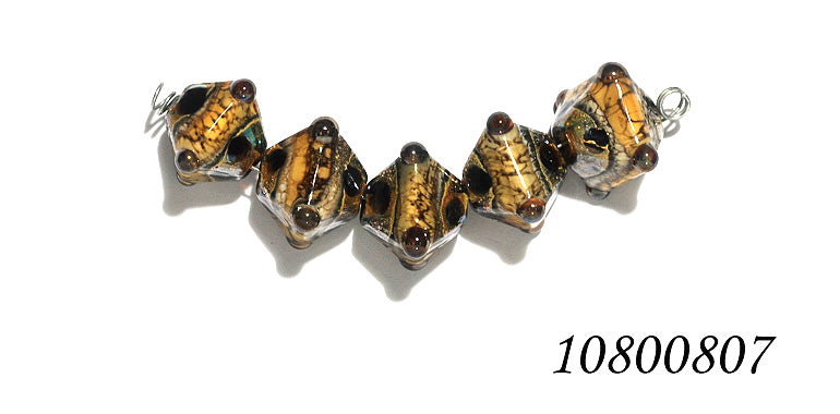 10800807 - Five Black w/Yellow Silver Foil Crystal Beads