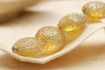 10801212 - Four Golden Yellow Metallic Lentil Beads