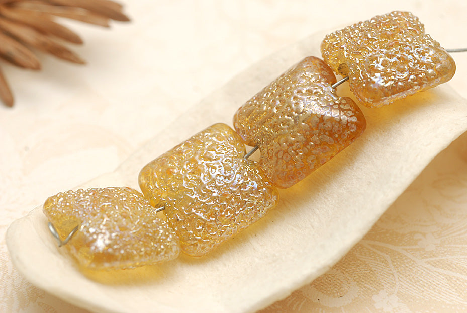 10801214 - Four Golden Yellow Metallic Pillow Beads