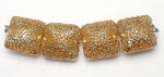 10801214 - Four Golden Yellow Metallic Pillow Beads