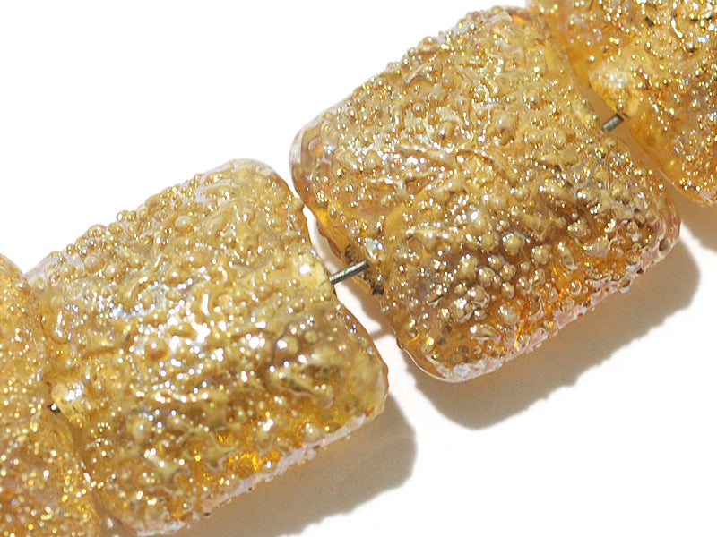 10801214 - Four Golden Yellow Metallic Pillow Beads