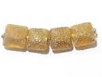 10801214 - Four Golden Yellow Metallic Pillow Beads