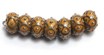 10801301 - Seven Butterscotch w/Metal Dots Rondelle Beads