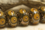 10801301 - Seven Butterscotch w/Metal Dots Rondelle Beads