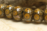 10801301 - Seven Butterscotch w/Metal Dots Rondelle Beads