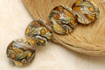 10801712 - Four Butterscotch Stardust Lentil Beads