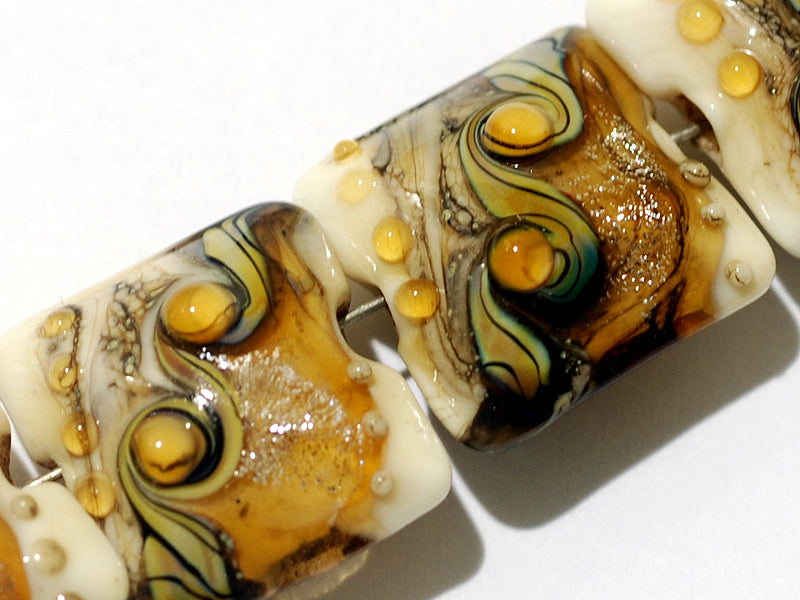 10801714 - Four Butterscotch Stardust Pillow Beads