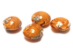 10801912 - Four Amber Wave Lentil Beads